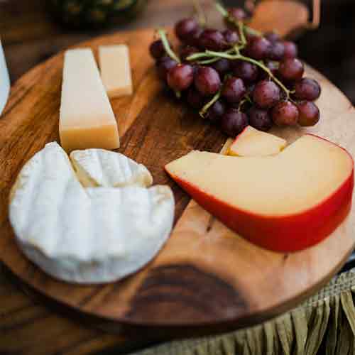 slice of edam cheese amongst others on a table