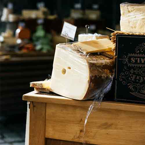 a slice on ememtal cheese on a table